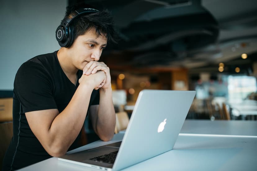Trader studying charts on a laptop
